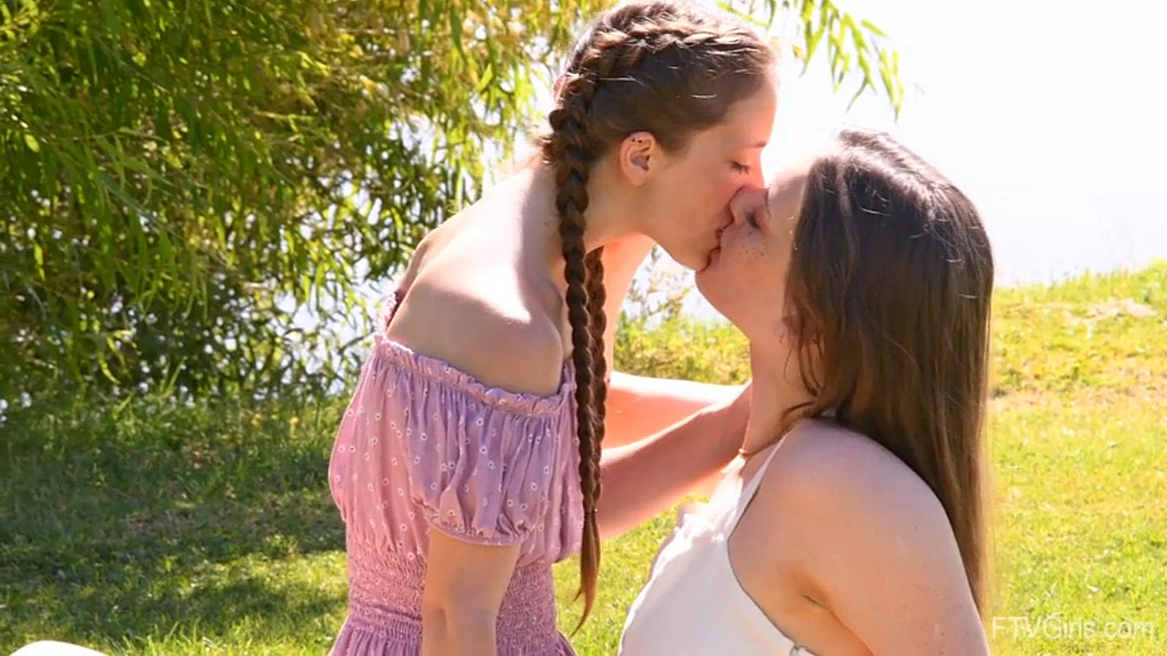 Real-life Lesbians are kissing outdoors